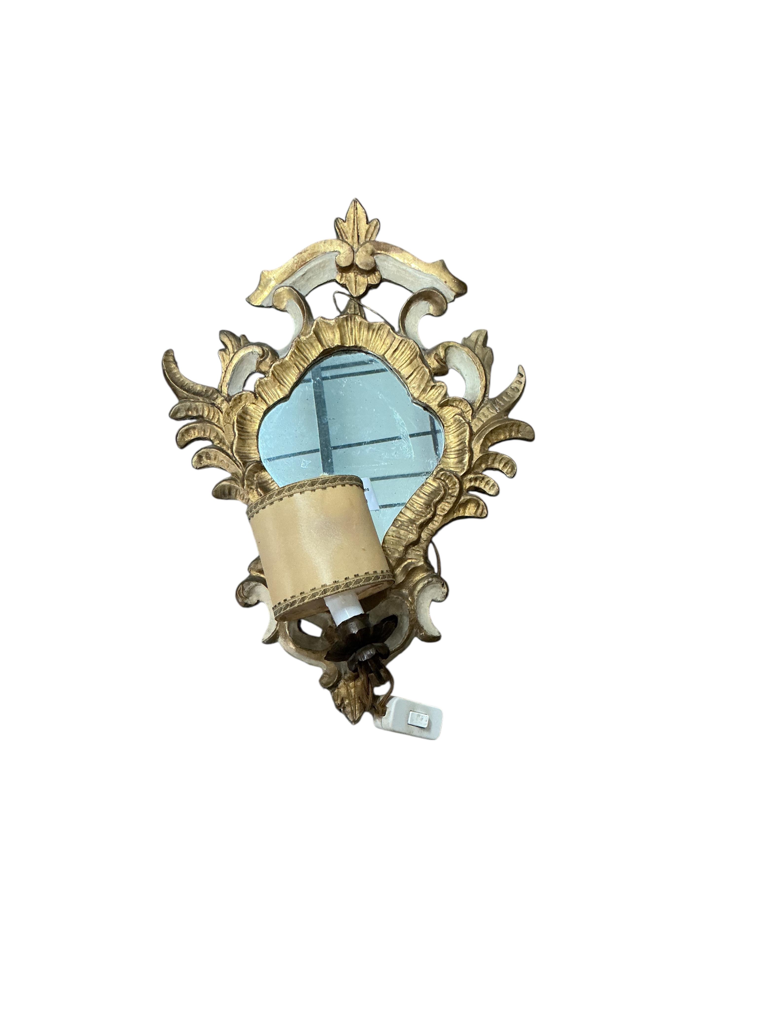 A pair of Italian parcel gilt framed Rococo Revival single light girandole wall mirrors, width 36cm, height 48cm